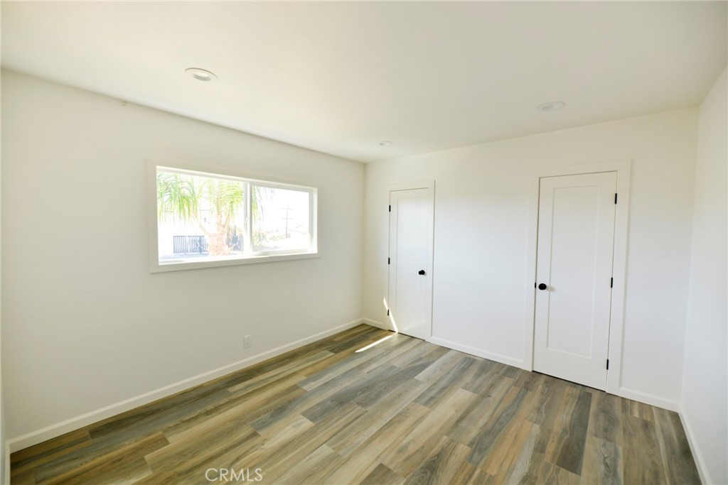 262 Avenida Victoria, Unit 4 San Clemente, CA 92672 - Photo 8 of 24 a view of a room with wooden floor and cabinet