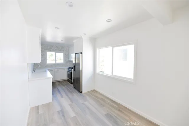 a view of a kitchen and a sink window
