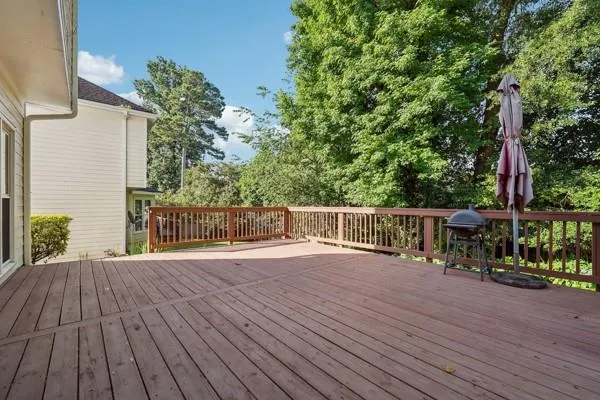 a view of a house with wooden deck