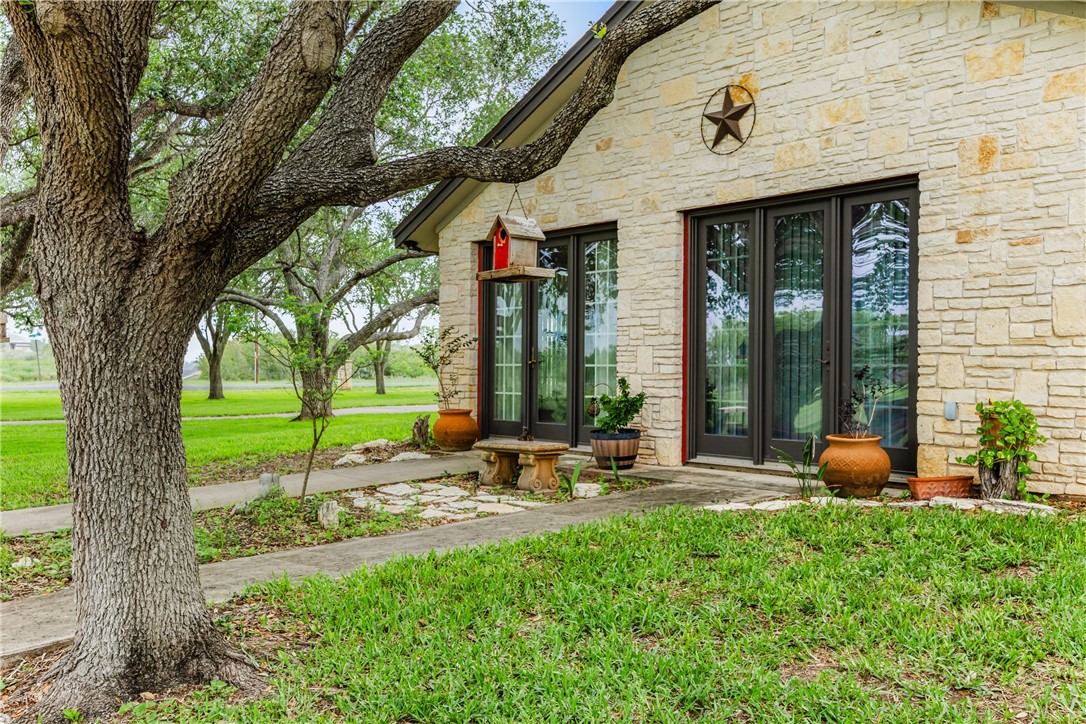 345 Trail Ridge Drive Sandia, TX 78383 - Photo 10 of 40 a view of a chair and table in backyard of the house