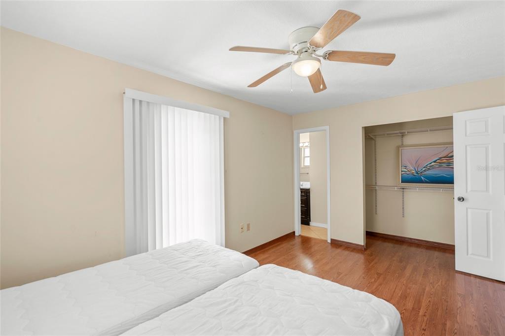 1036 Hope Street Venice, FL 34285 - Photo 12 of 41 a bedroom with a bed and a chandelier