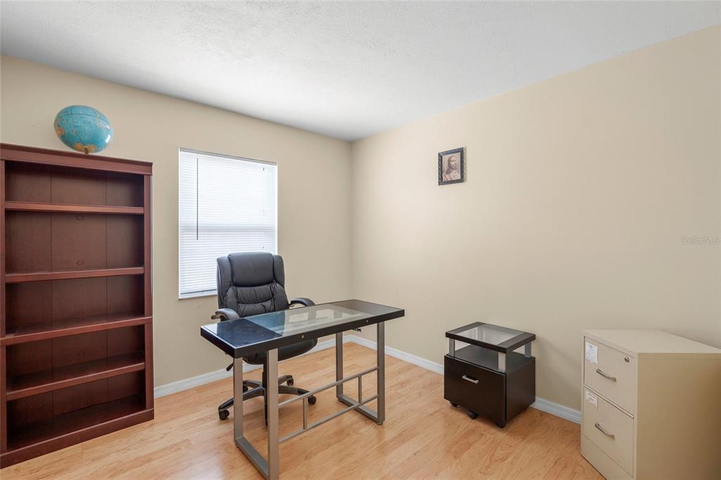 1036 Hope Street Venice, FL 34285 - Photo 16 of 41 a view of workspace with wooden floor