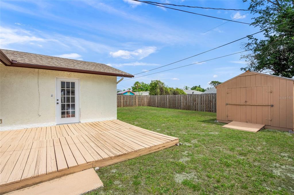 1036 Hope Street Venice, FL 34285 - Photo 18 of 41 a view of backyard with small cabin