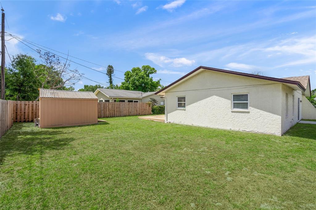 1036 Hope Street Venice, FL 34285 - Photo 20 of 41 a front view of house with yard and trees in the background