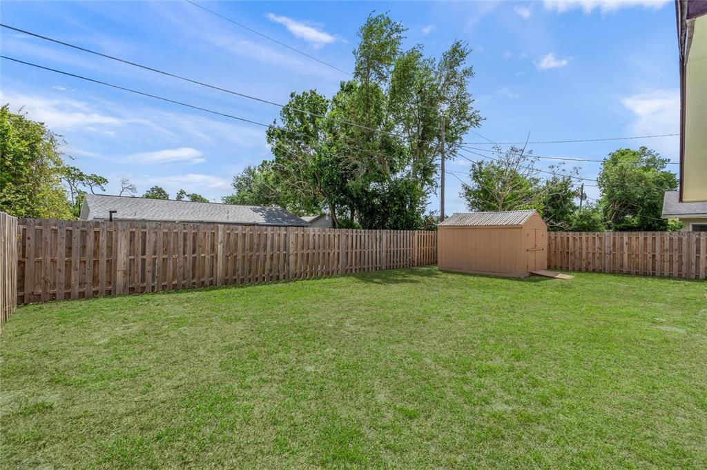 1036 Hope Street Venice, FL 34285 - Photo 21 of 41 a view of a backyard with green space