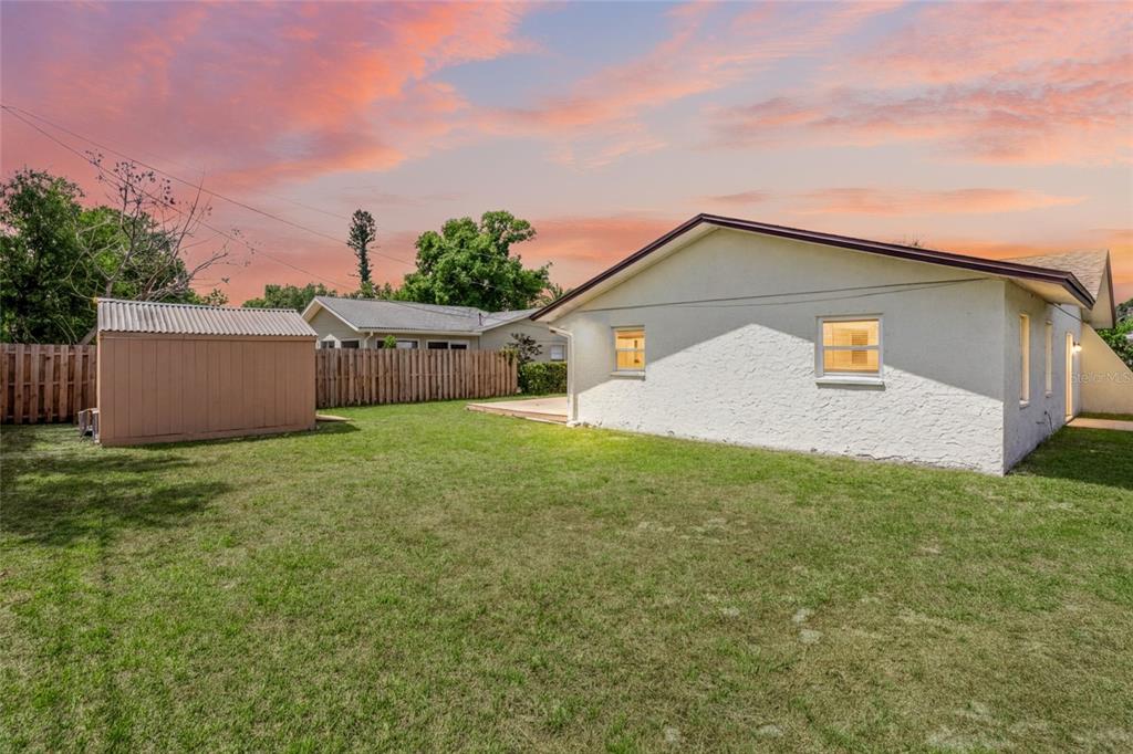 1036 Hope Street Venice, FL 34285 - Photo 22 of 41 a backyard of a house with lots of green space