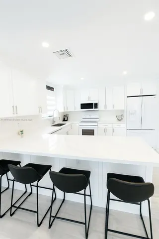 a bedroom with a bed and hallway