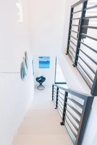 a front view of a house with swimming pool having outdoor seating