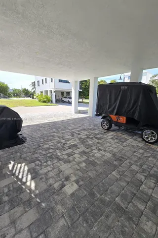 a view of a livingroom with workspace and a couch