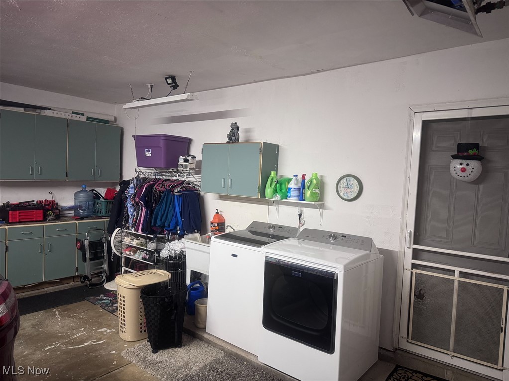 240 Spring Creek Road Northfield, OH 44067 - Photo 8 of 39 Clothes washing area featuring cabinets and independent washer and dryer