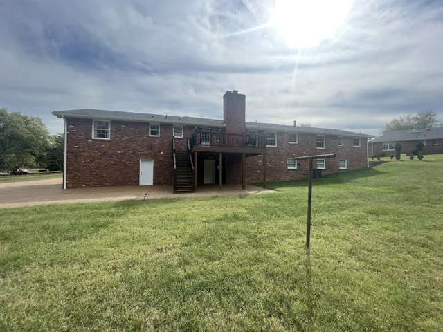 a view of deck with wooden floor and fence