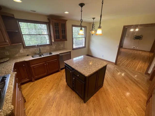 a kitchen with sink and window