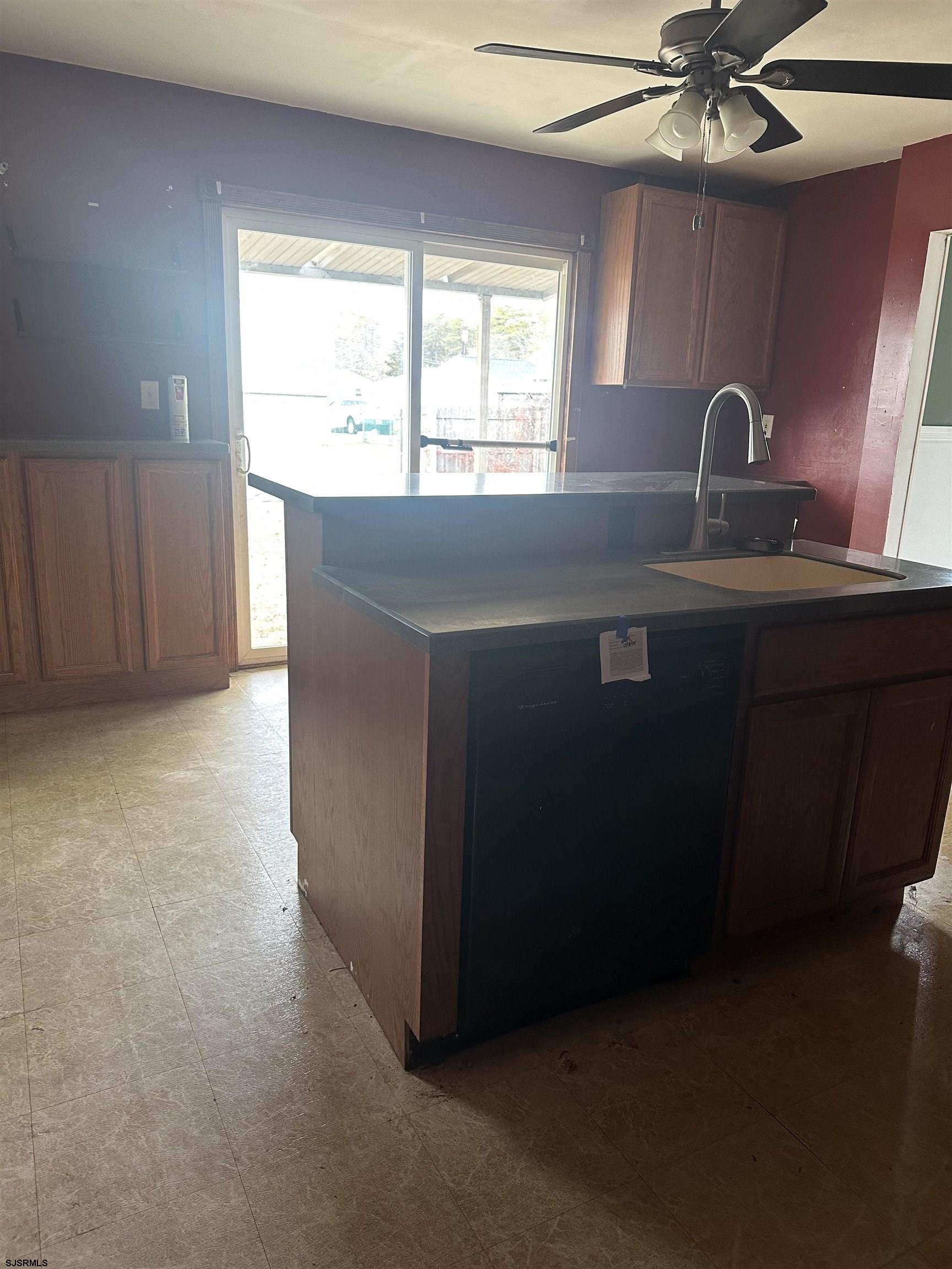 968 Hazelwood Road Toms River, NJ 08753 - Photo 11 of 25 a kitchen with a sink and a window