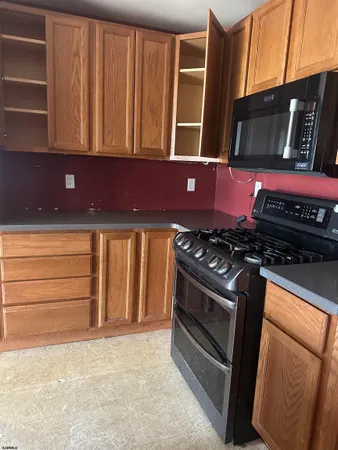 a kitchen with a stove and a cabinet