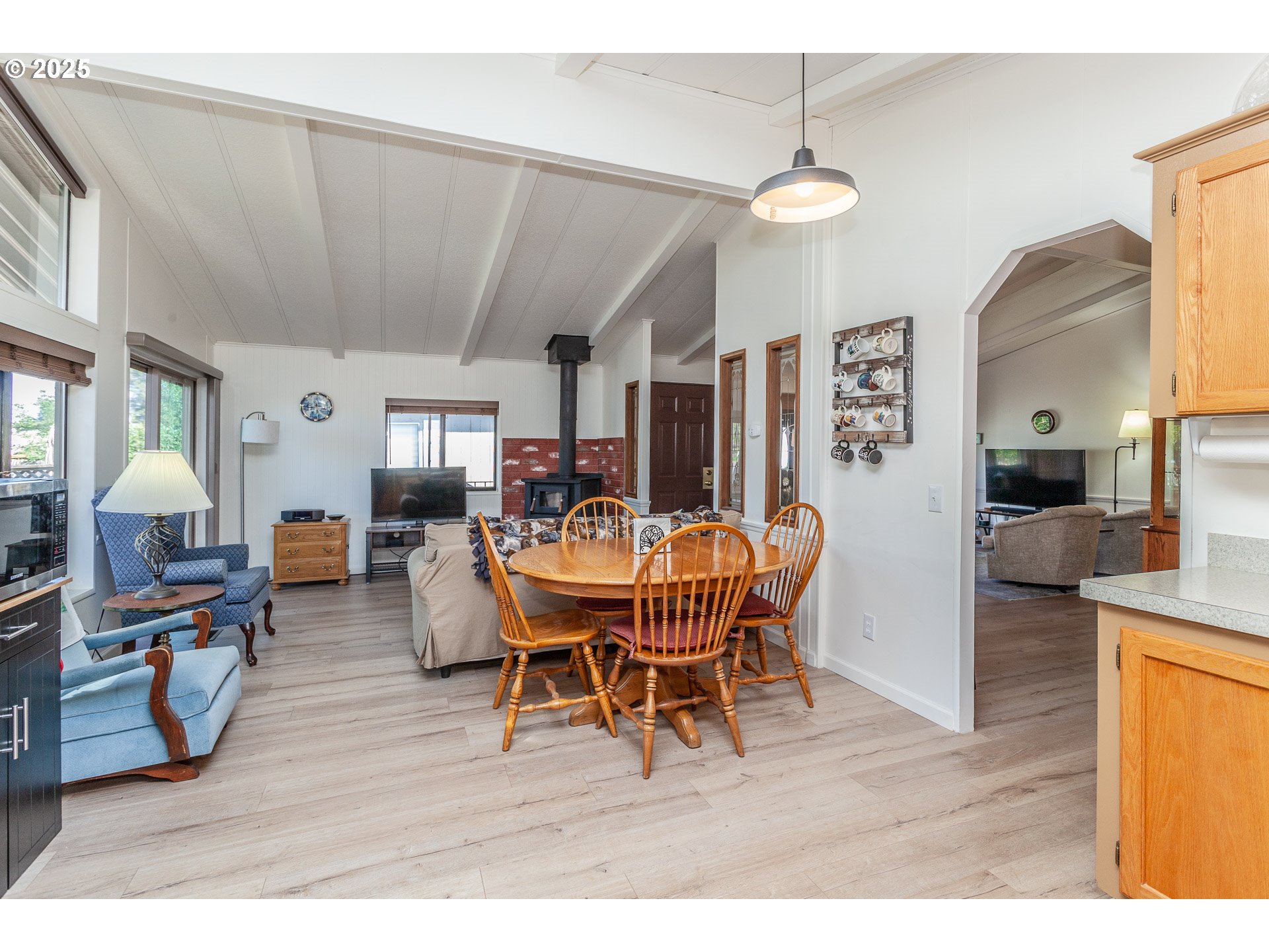 7455 Southeast King Road, Unit 53 Milwaukie, OR 97222 - Photo 12 of 33 a dining room with furniture and wooden floor