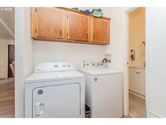 a view of a chairs and table in the balcony