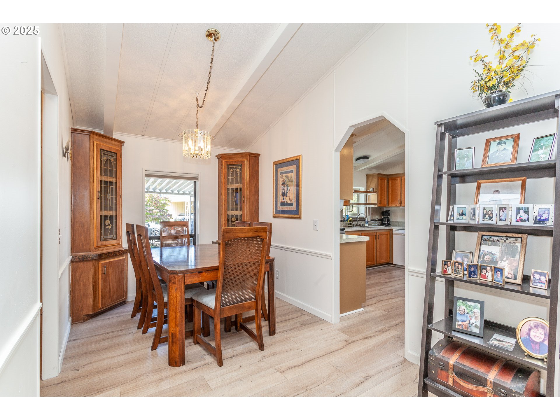 7455 Southeast King Road, Unit 53 Milwaukie, OR 97222 - Photo 6 of 33 a view of a dining room with furniture and a book shelf
