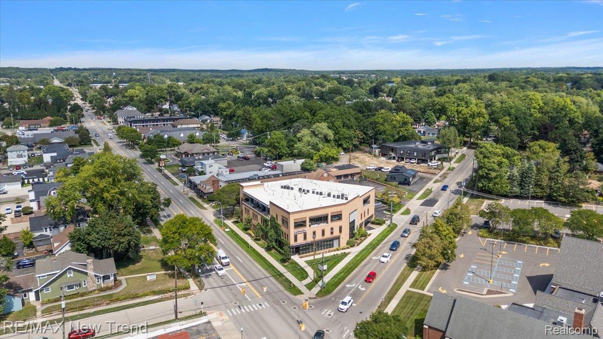 804 North Main Street, Unit 2H Rochester, MI 48307 - Photo 49 of 52 Contemporary commercial building featuring a brick facade, multiple levels, and extensive fenestration