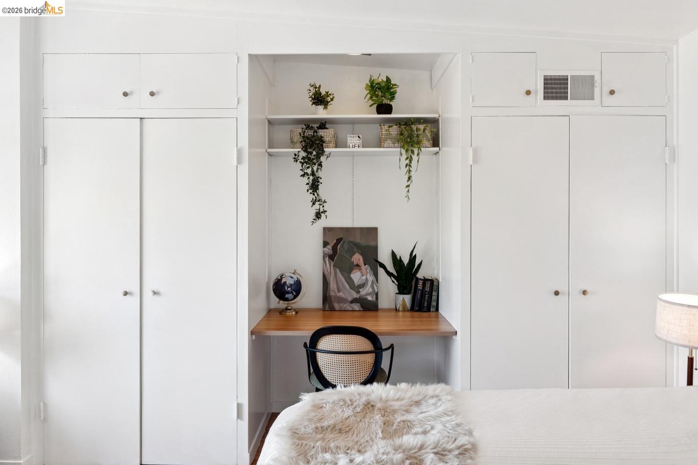 2301 Oak Street Berkeley, CA 94708 - Photo 12 of 61 Built-in desk nook with wood-finish surface, integrated shelving, and adjacent white cabinetry