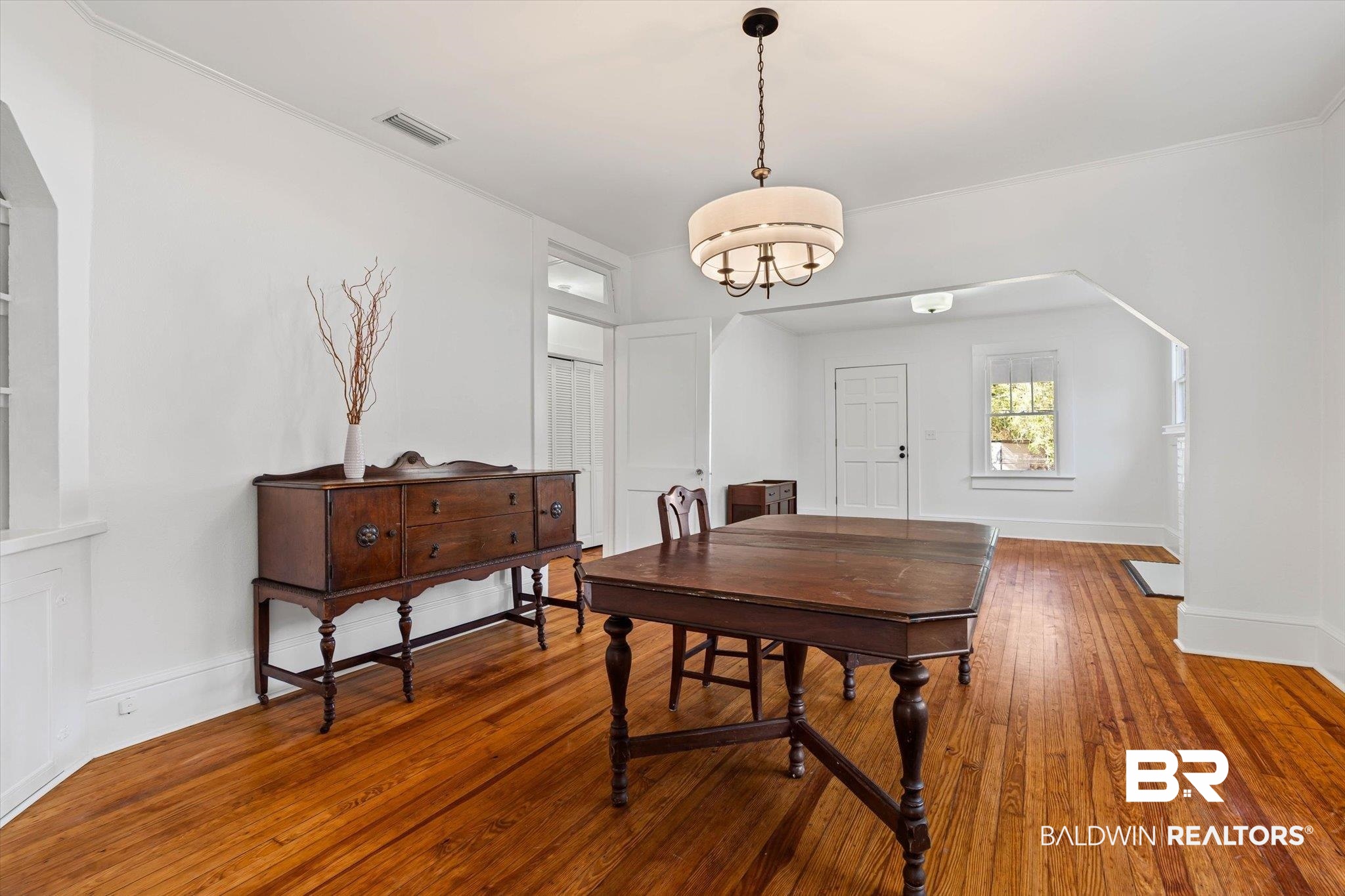 2153 Old Government Street Mobile, AL 36606 - Photo 5 of 23 Dining area with arched walkways and hardwood / wood-style flooring
