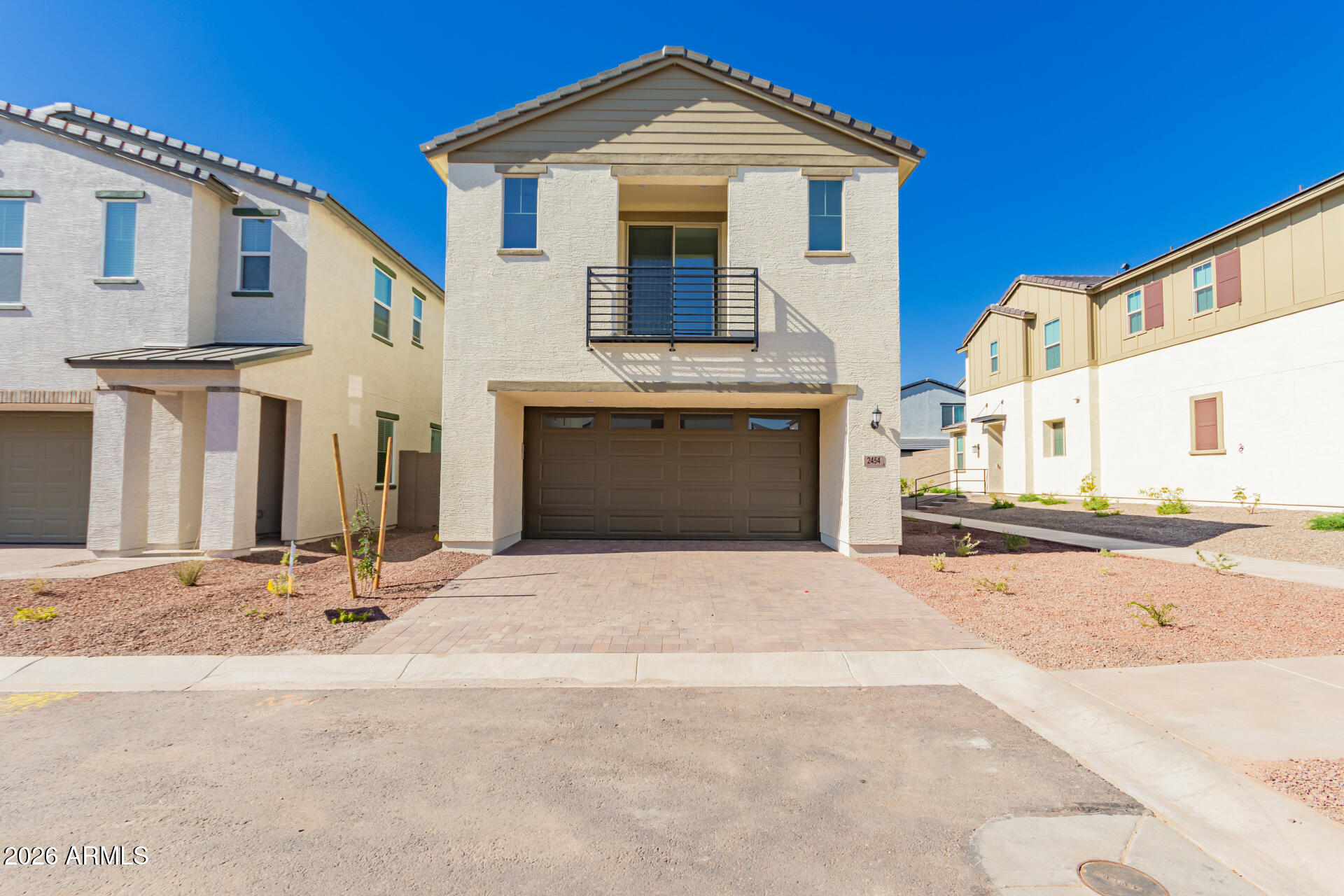 a front view of a house with yard