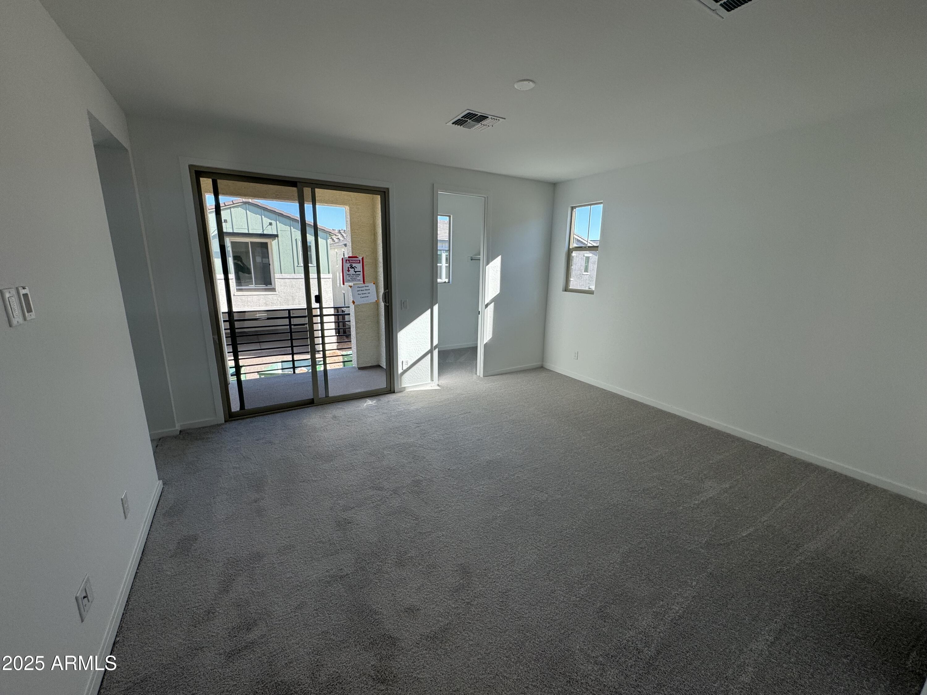 2454 West Maximo Way Phoenix, AZ 85085 - Photo 11 of 27 a view of an empty room with a fireplace