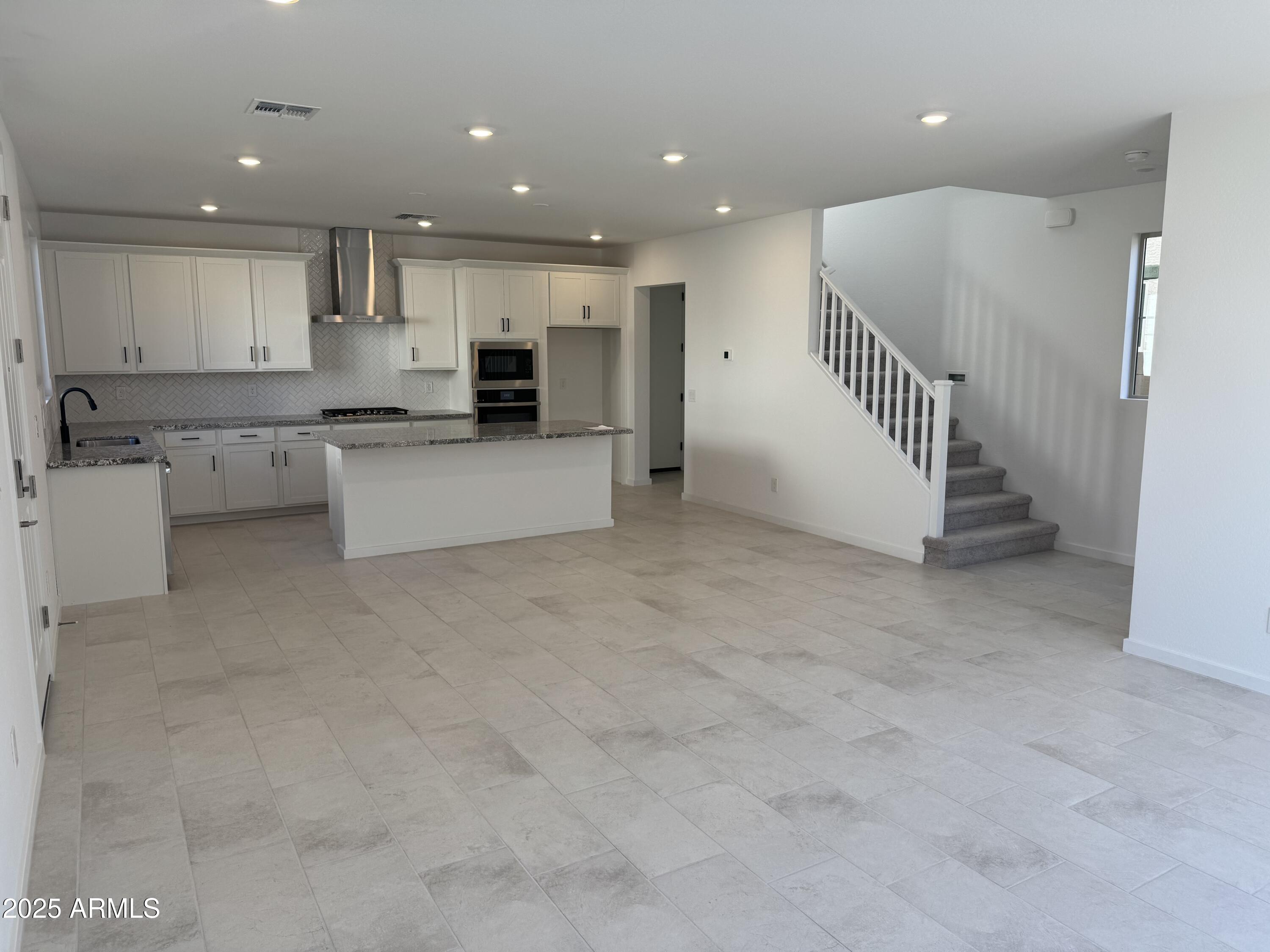 2454 West Maximo Way Phoenix, AZ 85085 - Photo 2 of 27 a view of a kitchen with a sink and cabinets