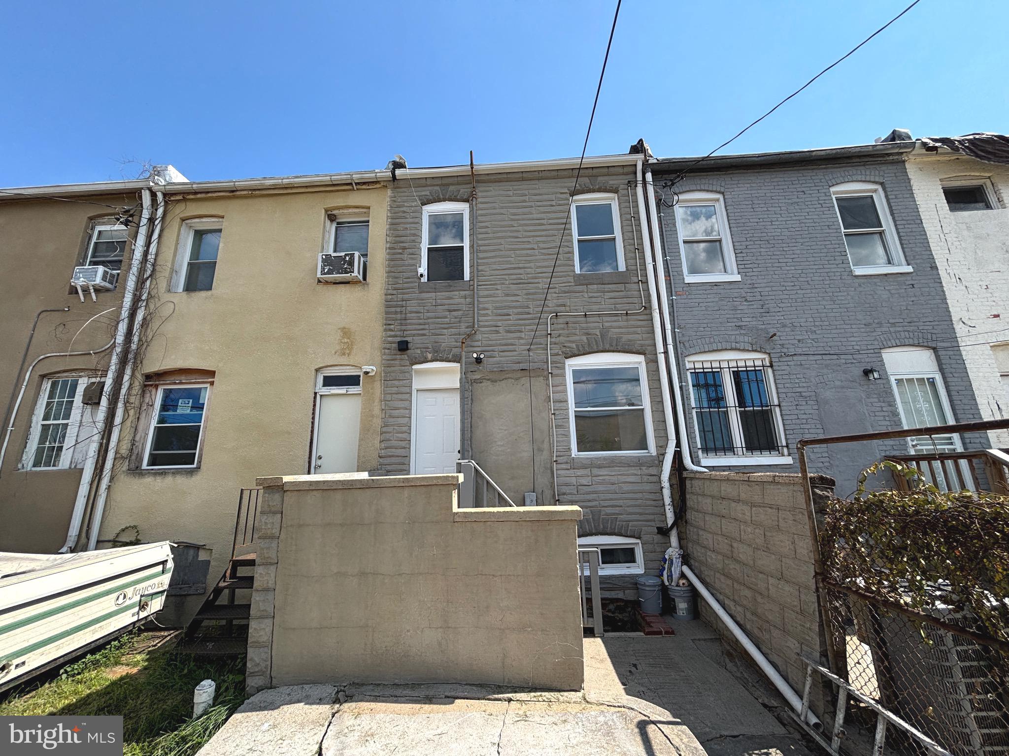 2636 Harford Road Baltimore, MD 21218 - Photo 18 of 18 a front view of a house with a yard