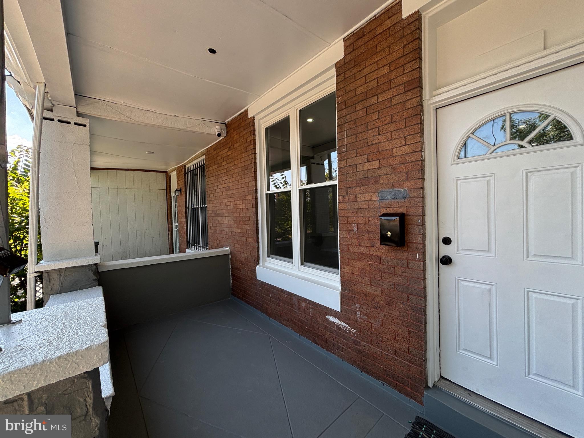 2636 Harford Road Baltimore, MD 21218 - Photo 3 of 18 a living room with a large window and furniture