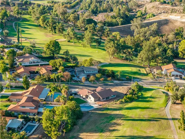 a view of a swimming pool with a yard