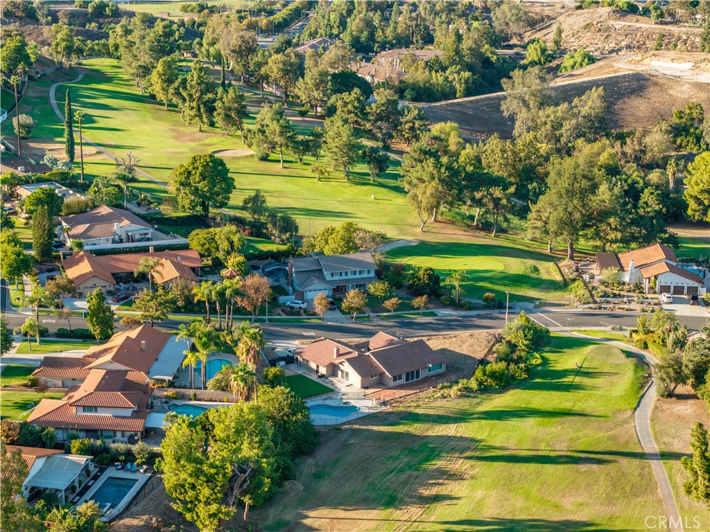 1450 Vía Vallarta Riverside, CA 92506 - Photo 1 of 36 a view of a swimming pool with a yard