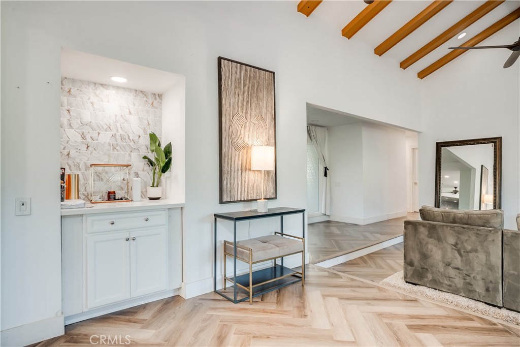 1450 Vía Vallarta Riverside, CA 92506 - Photo 13 of 36 a living room with furniture and wooden floor