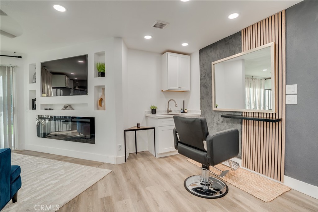 1450 Vía Vallarta Riverside, CA 92506 - Photo 20 of 36 a living room with furniture and a fireplace