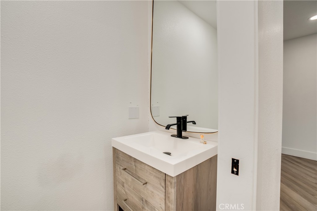 1450 Vía Vallarta Riverside, CA 92506 - Photo 22 of 36 a bathroom with a sink and a mirror