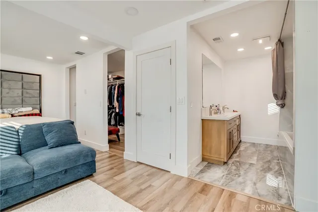 a living room with furniture and kitchen view