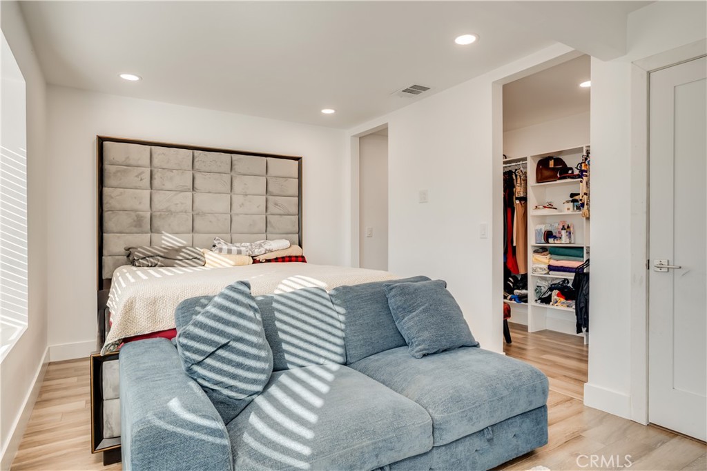 1450 Vía Vallarta Riverside, CA 92506 - Photo 29 of 36 a large bedroom with a bed and a large window