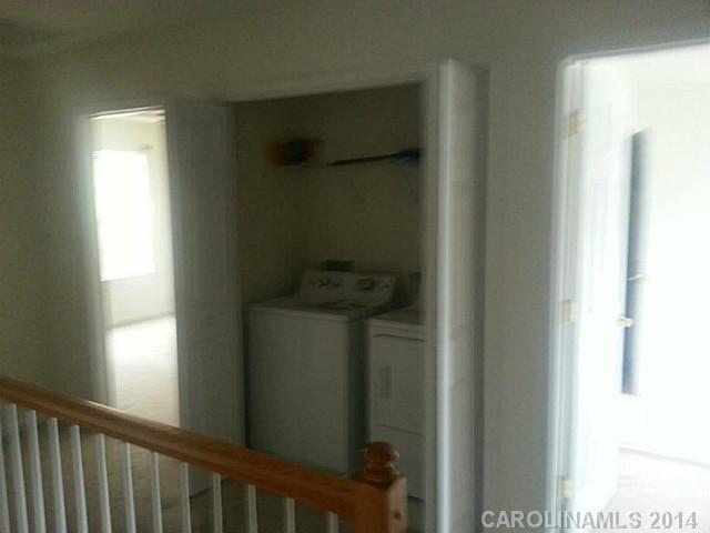 911 Reigate Road Charlotte, NC 28262 - Photo 12 of 14 a view of entryway with a hallway