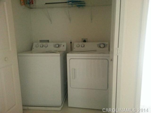 911 Reigate Road Charlotte, NC 28262 - Photo 13 of 14 a utility room with dryer and washer