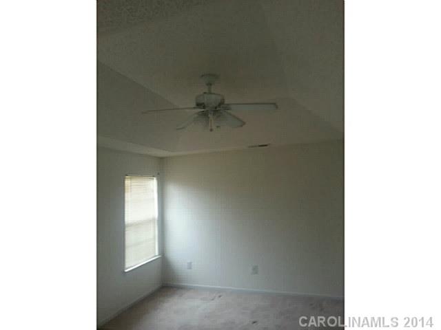 911 Reigate Road Charlotte, NC 28262 - Photo 14 of 14 a view of an empty room with a window