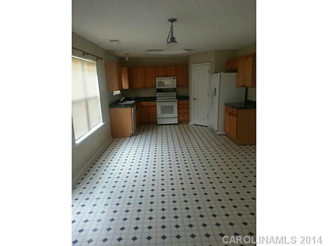 911 Reigate Road Charlotte, NC 28262 - Photo 7 of 14 a view of a kitchen with a sink