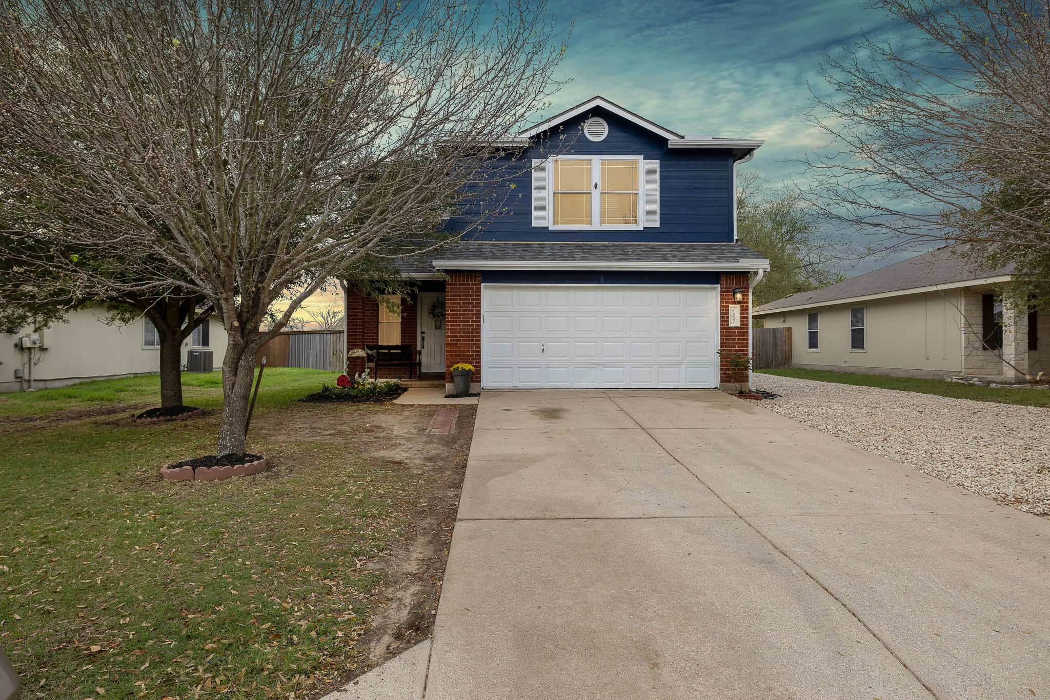 a front view of a house with a yard