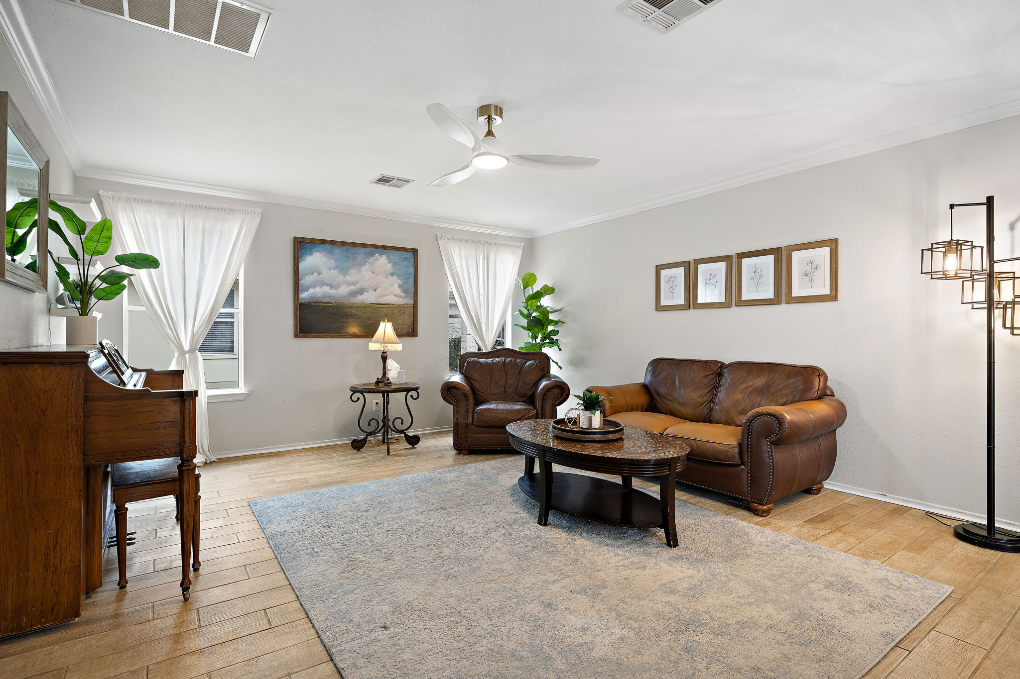 107 Easy Street Hutto, TX 78634 - Photo 11 of 34 a living room with furniture and a wooden floor