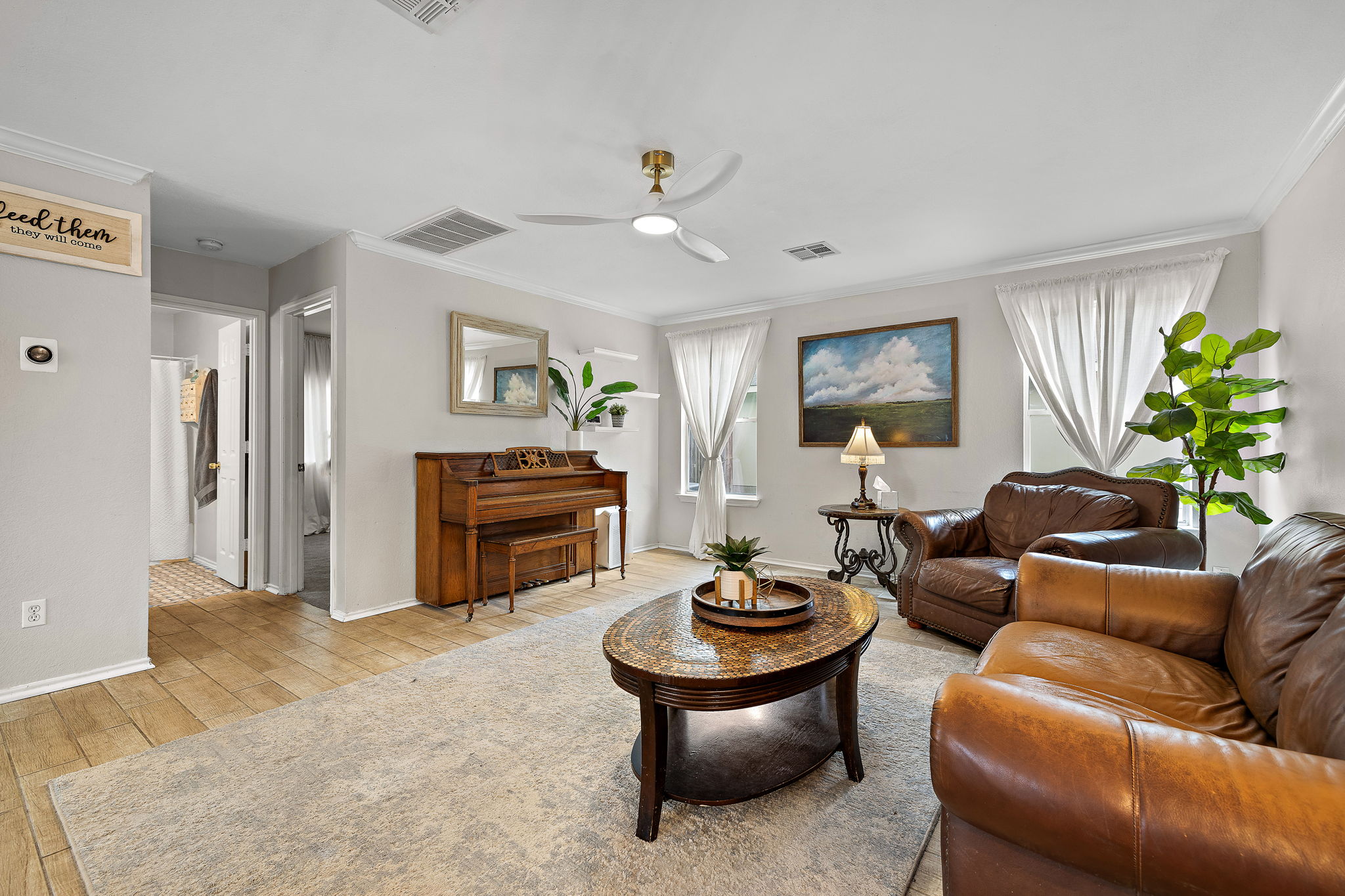 107 Easy Street Hutto, TX 78634 - Photo 12 of 34 a living room with furniture and a fireplace