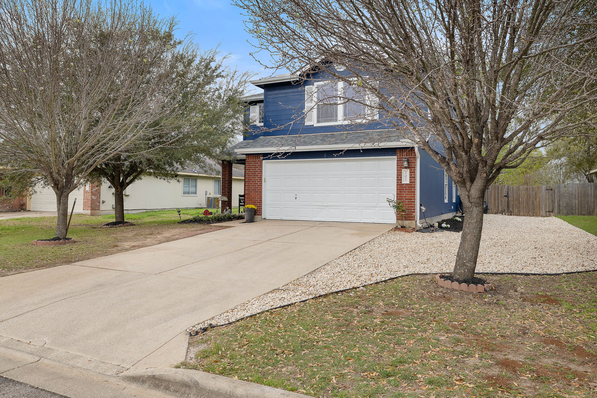 107 Easy Street Hutto, TX 78634 - Photo 2 of 34 a front view of house with a yard