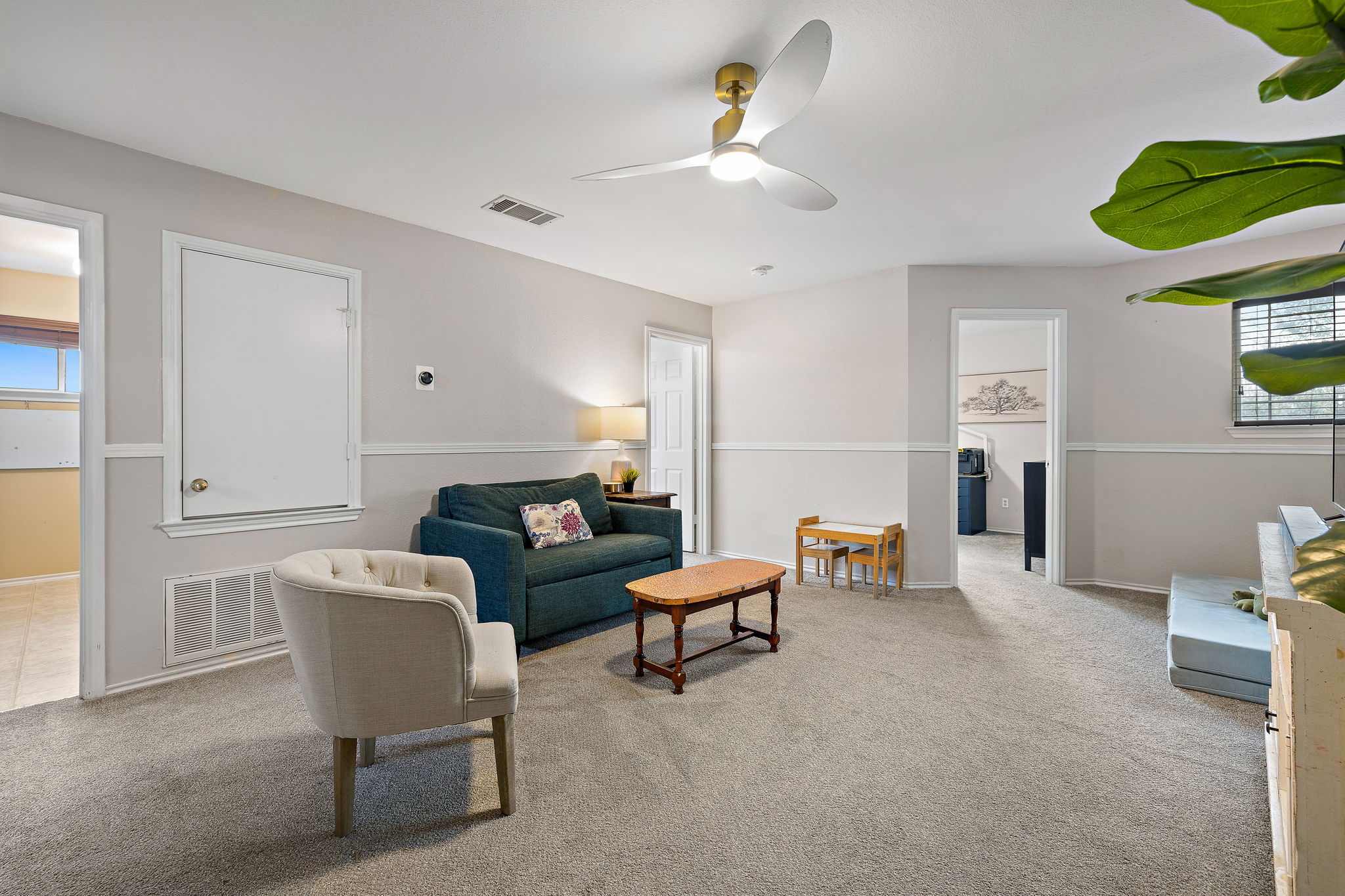 107 Easy Street Hutto, TX 78634 - Photo 24 of 34 a living room with furniture and a chair