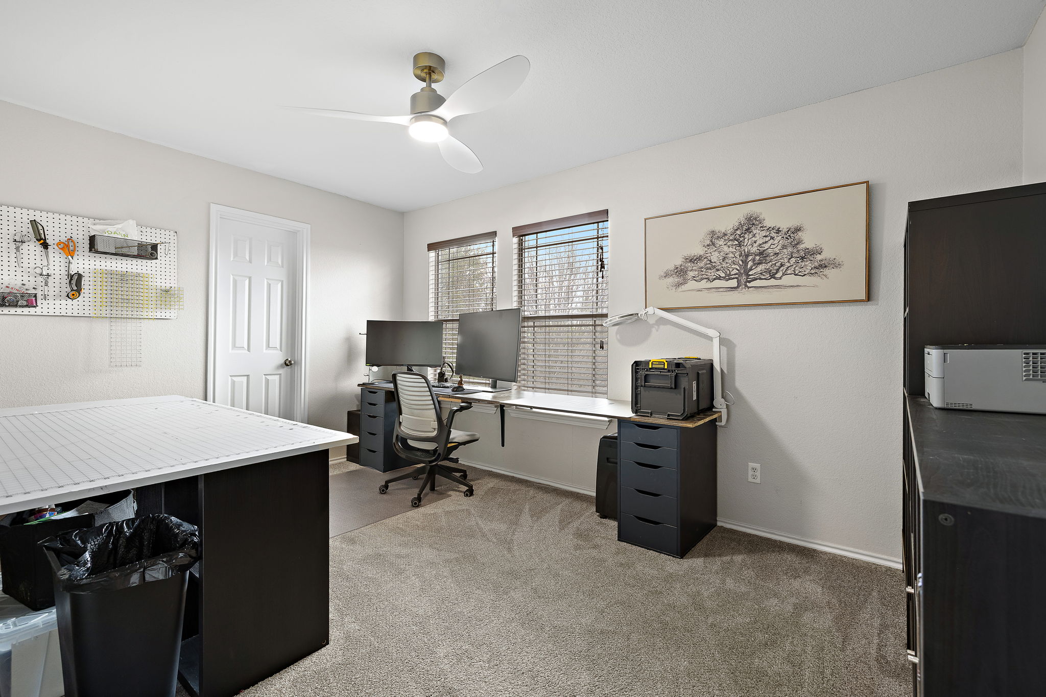 107 Easy Street Hutto, TX 78634 - Photo 25 of 34 a view of a workspace with furniture and a window
