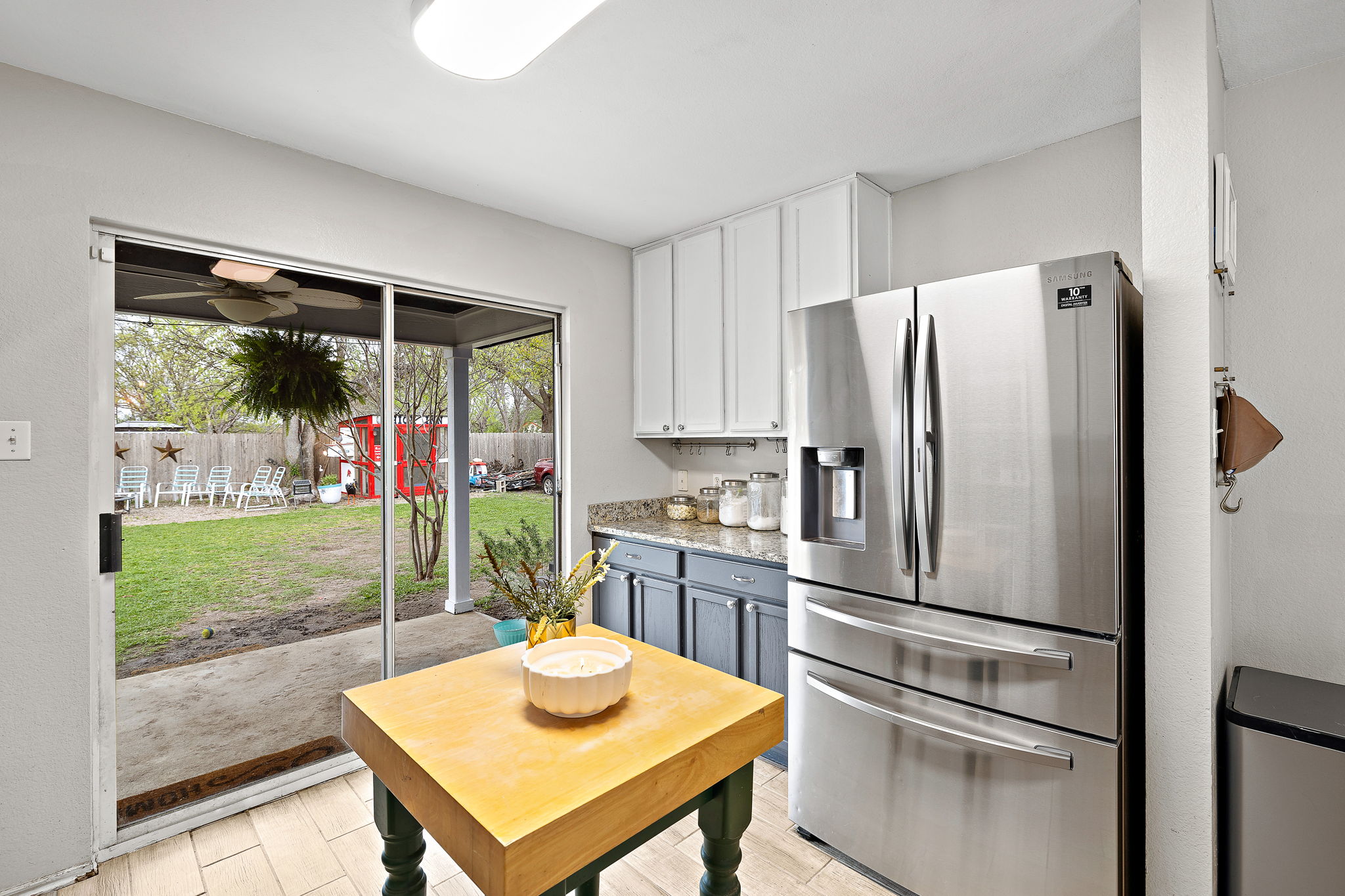 107 Easy Street Hutto, TX 78634 - Photo 8 of 34 a kitchen with stainless steel appliances a refrigerator and a table