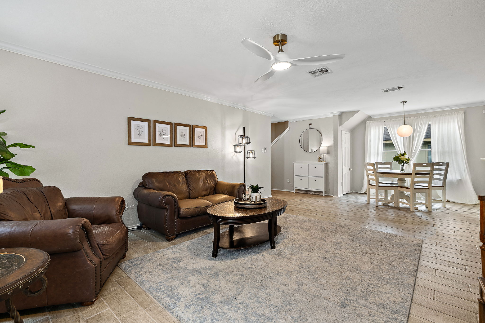 107 Easy Street Hutto, TX 78634 - Photo 10 of 34 a living room with furniture and wooden floor