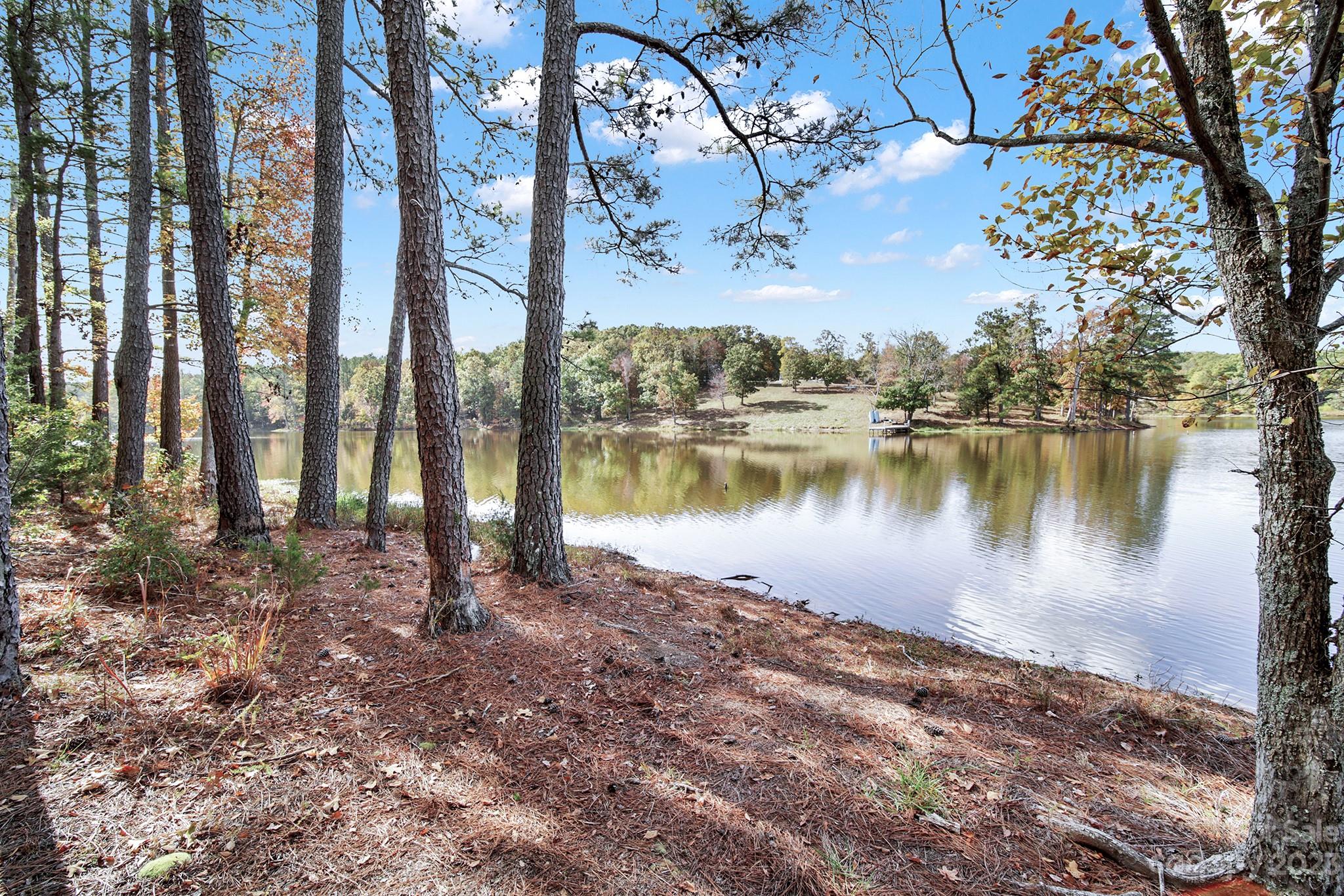 Lot 22 Mountain Lakes Road Chester, SC 29706 - Photo 7 of 20 a view of a lake with houses in the background