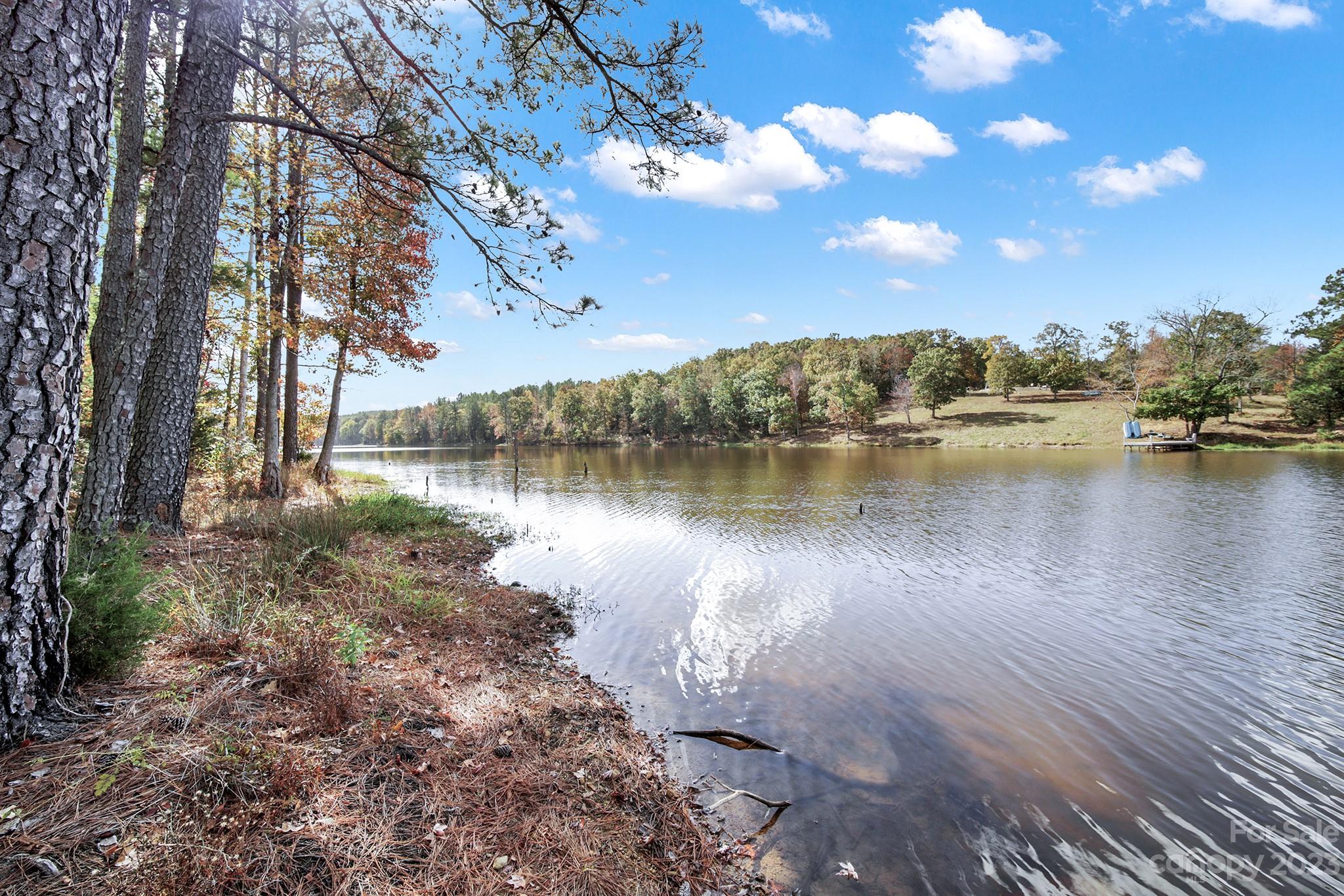 Lot 22 Mountain Lakes Road Chester, SC 29706 - Photo 8 of 20 a view of a lake with houses